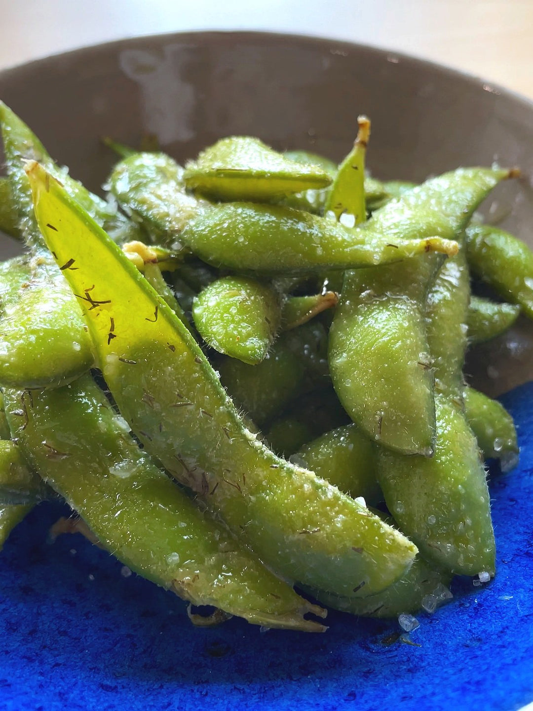 A close up phot of a bowl of Quick & Easy Dill Pickle Edamame