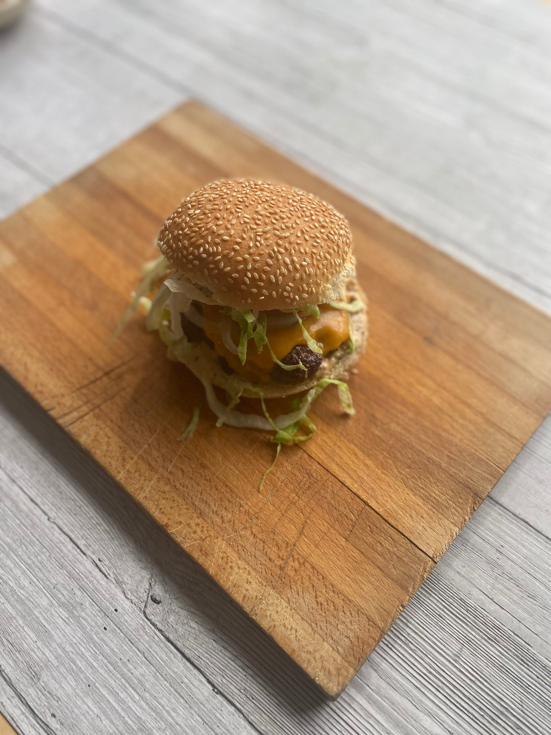 Smak Dab Smash Burger on a wooden board