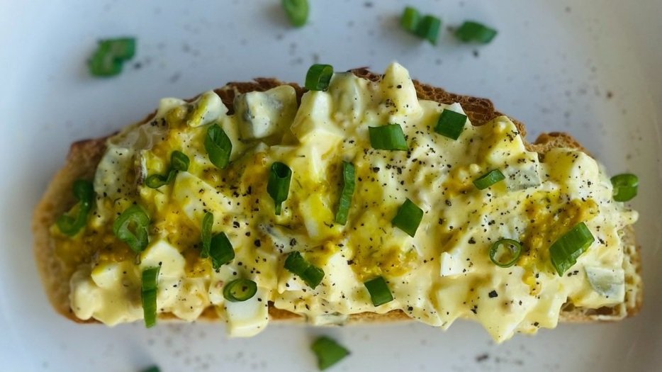 White Wine Herb Egg Salad topped with chopped green onion